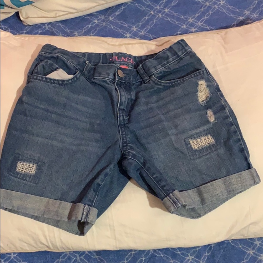 Blue jean shorts with rips
